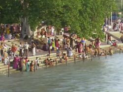 WS People enjoying on banks of Ganges / Haridwar, Uttarakhand, India Stock Footage