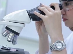 HD : Scientist Couple using microscope Stock Footage