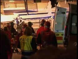 WRAP Night scenes from quake,  new tremor, tents ADDS body News Clip