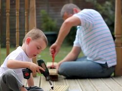 Father teaches son some home improvement skills Stock Footage