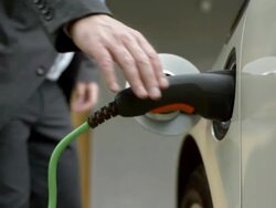 HD: Man Unplugging His Electric Car At Home Stock Footage