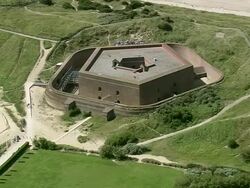MS AERIAL DS ZI View of Napoleonic Fort at Ostend beach / Flanders, Belgium Stock Footage