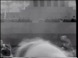 B/W 1961 Yuri Gagarin (first man in space) on balcony waving / crowd waving in foreground / Moscow Stock Footage