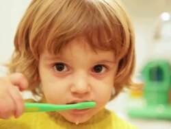 HD: Girl washing teeth Stock Footage