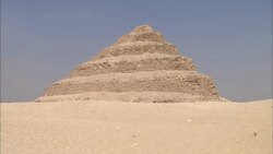 Sand surrounds the ancient Saqqara Pyramid in Egypt. Stock Footage
