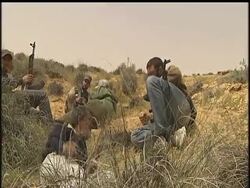 Near the village of Al Majabira, Libyan rebels clash with forces loyal to Moammar Gadhafi. After what at times was fierce fighting, rebels say their forces retook the village from government troops. News Clip