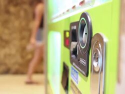 Women Buying canned Coffee from Vending Machine Stock Footage