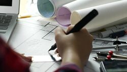 Over the shoulder Female Architect drawing on blueprint Stock Footage