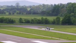 'WS PAN AERIAL Shot of small commuter plane which is on running track / Culpeper VA to Kearny, United States ' Stock Footage