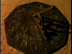 T/L Sundial, with stone background, shadow moves around timepiece Stock Footage