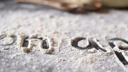 Close up of words written in flour Stock Footage