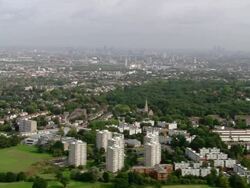 Aerial wide shot pan view of London skyline from Richmond Park / London, England Stock Footage