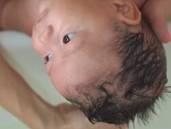 Baby taking a bath Stock Footage