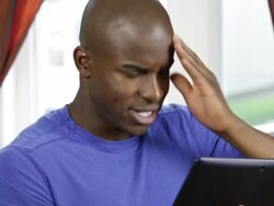 Angry man with digital tablet Stock Footage