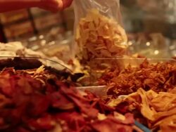 MS PAN Brazilian typical desserts dried fruits man serving from a basket / Sao Paulo, Brazil Stock Footage