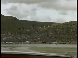 City and harbour from a boat in the lake, WA, Peru Stock Footage