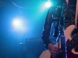 Bass guitarist singing and playing on stage. Stock Footage