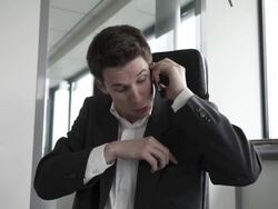 Stop Motion Track shot of businessman agressed by mobile and fix phones Stock Footage