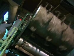 A technician operates an agitator for composting. Stock Footage