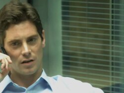 Man on phone in office; UK Stock Footage