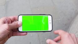 Man swiping a smartphone with a green screen Stock Footage