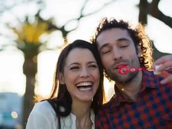 Blowing bubbles at sunset Stock Footage