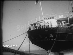 1953: GOA, INDIA: MS Silhouette cut-out of India w/ Goa highlighted. MORMUGAO PORT: VS Docked ships, 'Osaka' w/ people standing on deck, stern of 'Alma, Panama', Greek flag on ship 'Kaeoe, Eypoy' Greek letters. Instructional Video