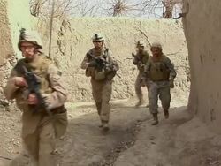 WS Group of soldiers walking in row / Musa Qala, Helmand Province, Afghanistan.   Stock Footage