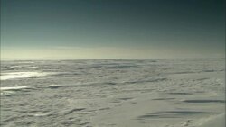 Snow covers a vast, desolate tundra. Stock Footage