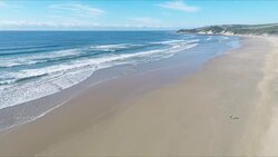 aerial view of lone figure on deserted beach Stock Footage