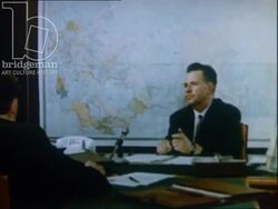 Piotr Ylatov speaking to camera, beach scenes and modern apartment blocks, USSR 1970s Stock Footage