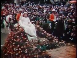 1939 Shirley Temple waving from float / Grand Marshall of Rose Bowl Parade / Pasadena, CA / newsreel Stock Footage
