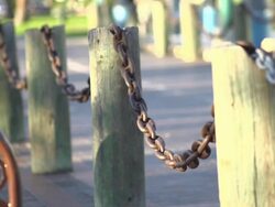 Skateboarder doing an ollie over chains. - Slow Motion - filmed at 240 fps Stock Footage
