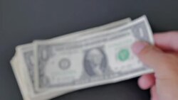 Picking up banknotes dollar from the stack of money Stock Footage
