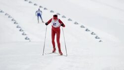 SLO MO female cross country skiing athlete in sprint Stock Footage