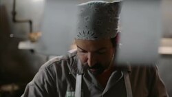 Restaurant chef prepares dinner plates on the expo line at ticket counter in kitchen Stock Footage