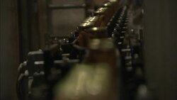 Jars full of frankfurters move along a conveyor belt. Stock Footage