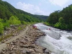 WS HA View of Tourists Whitewater rafting on river in Duck town / Ocoee, Tennessee, United States Stock Footage