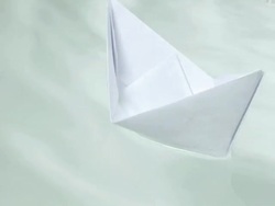 paper boat on the water Stock Footage