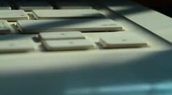 Time-lapse: Laptop Computer Keyboard with Sunlight from the Window Stock Footage