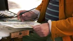 Shot of artist painting using watercolors a scene in Venice. Stock Footage