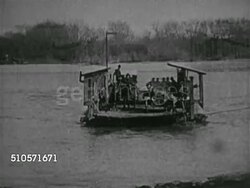 1920s: EARLY ROADS: Car driving down sand embankment, VS Car driving fast over railroad track, log in field, into & through narrow river water, flooded street, muddy street, flooded & muddy road. Silly, wacky. Instructional Video