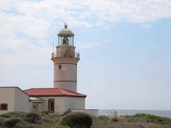 HD: Lighthouse and Wind Turbine Stock Footage