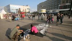 Street art- Chalk drawings on sidewalk at Alexanderplatz Stock Footage