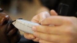Barber trims customer's moustache with precision in local New York City barbershop Stock Footage