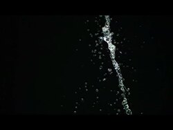 Water drops, pouring against black Stock Footage