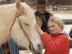 MS Girl chatting to horse and stroking it / Shell, Wyoming, United States Stock Footage
