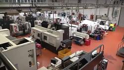 Engineers working on a factory floor News Clip