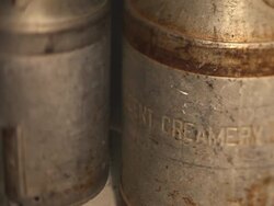 An old rusty and dented milk churn  Stock Footage
