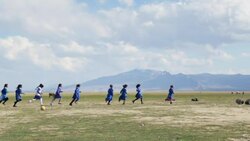 Kurdish school kids running on wide field in Eastern Anatolia. Stock Footage